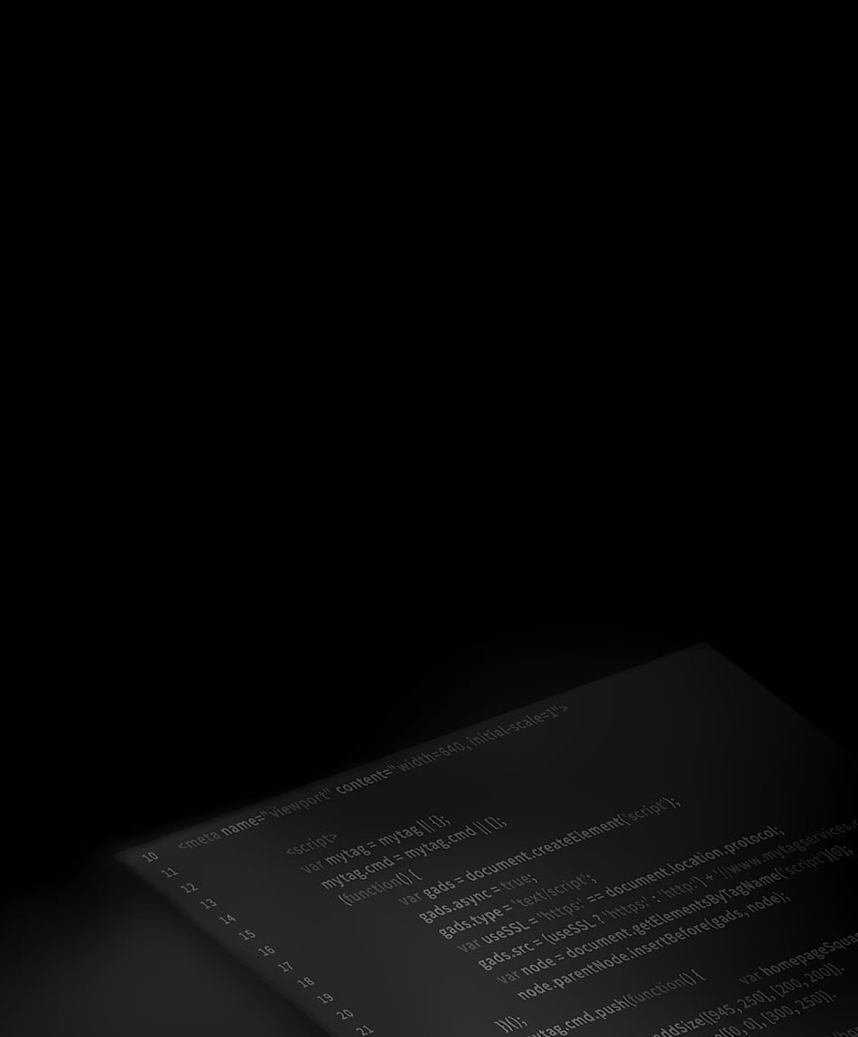 Website coding depicted on the monitor